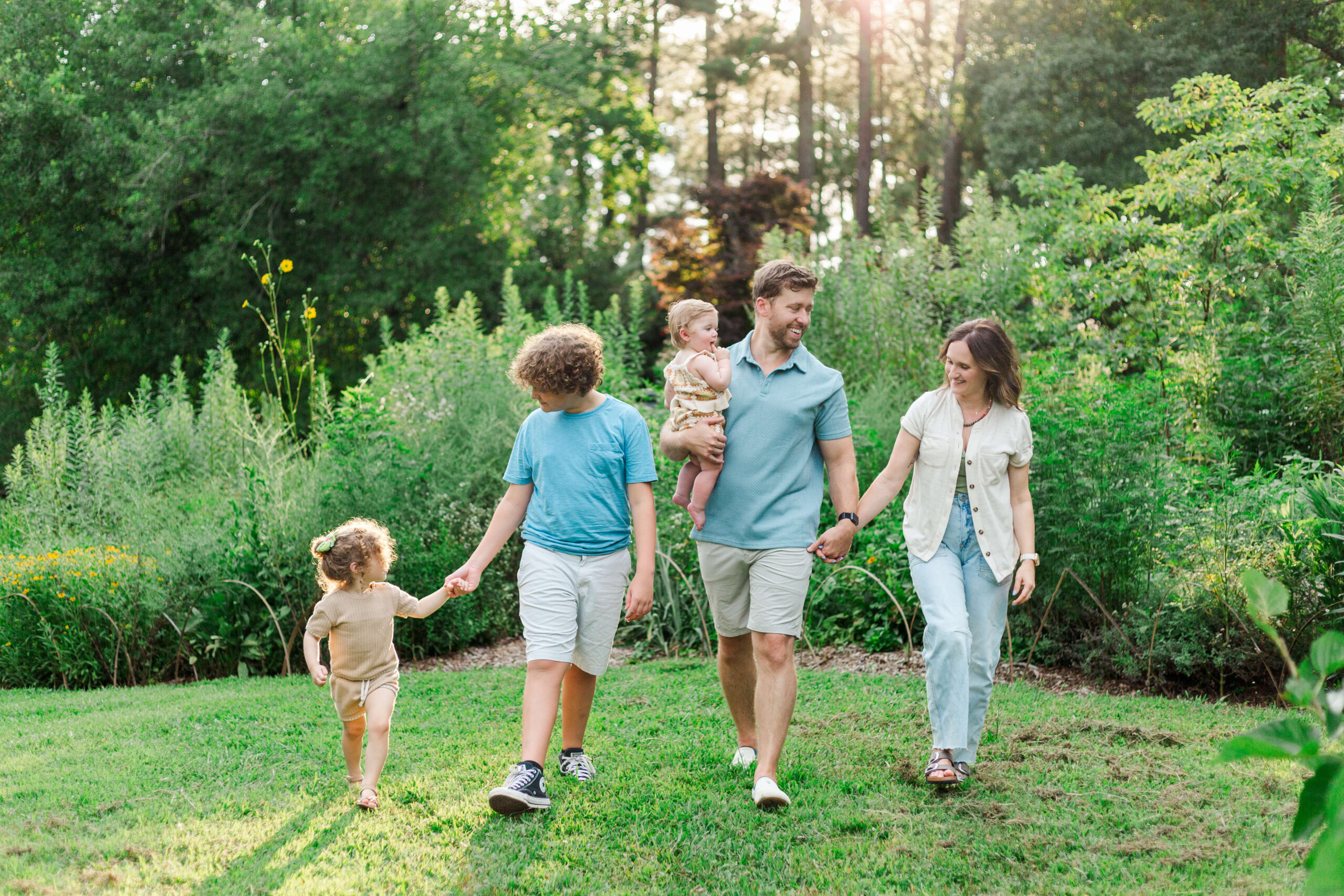 family walking together at the South Carolina Botanical Garden in Clemson, South Carolina.